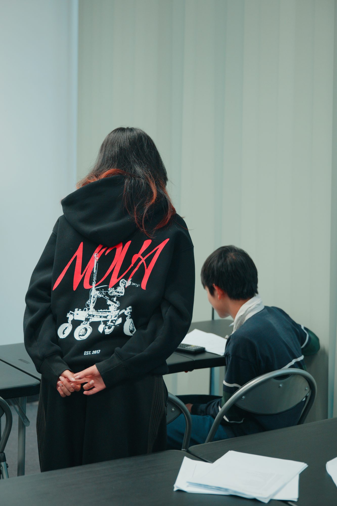 A Spartan Tuition tutor supporting a student during a class