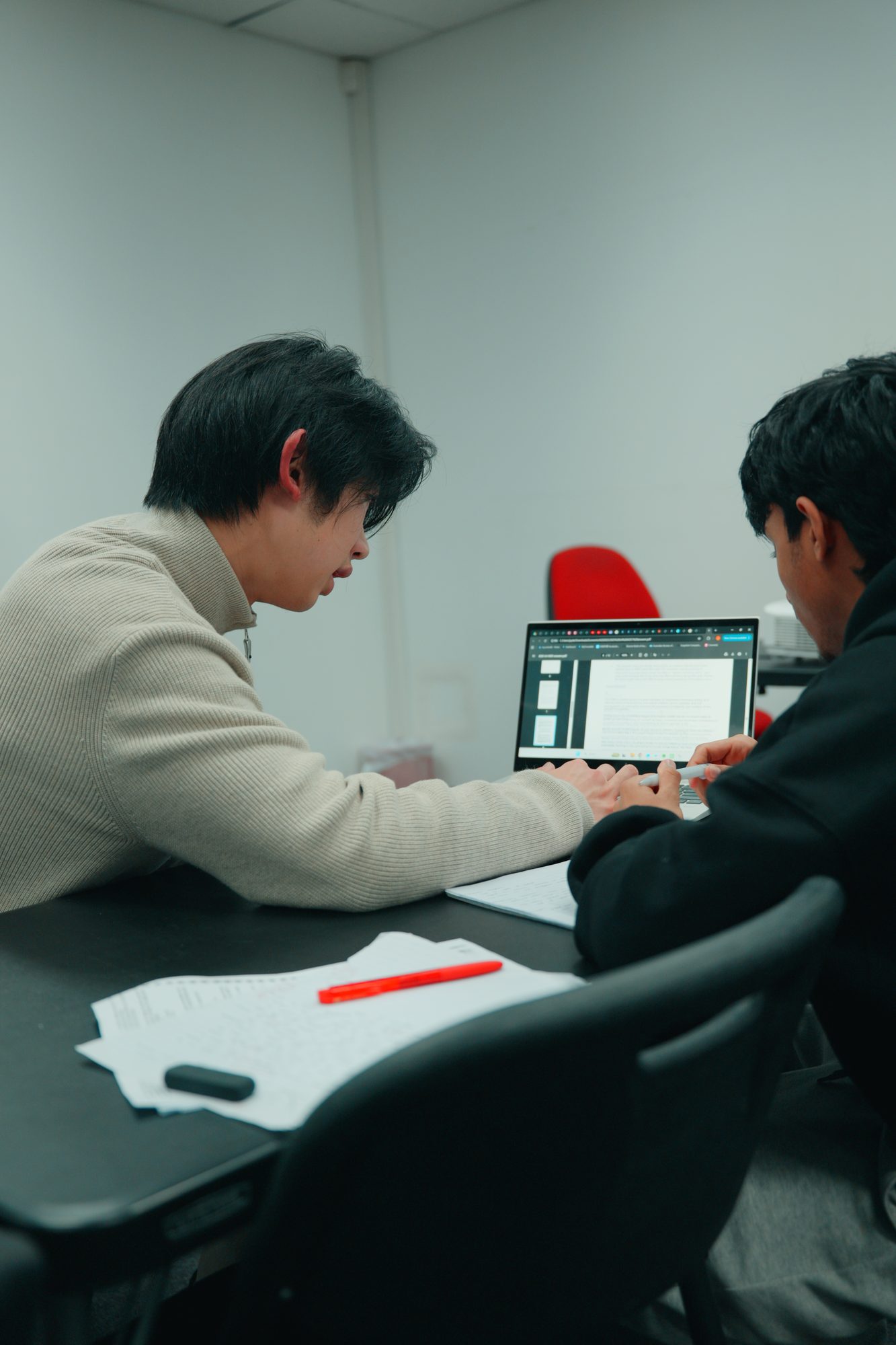 A Spartan Tuition tutor working one-on-one with a student