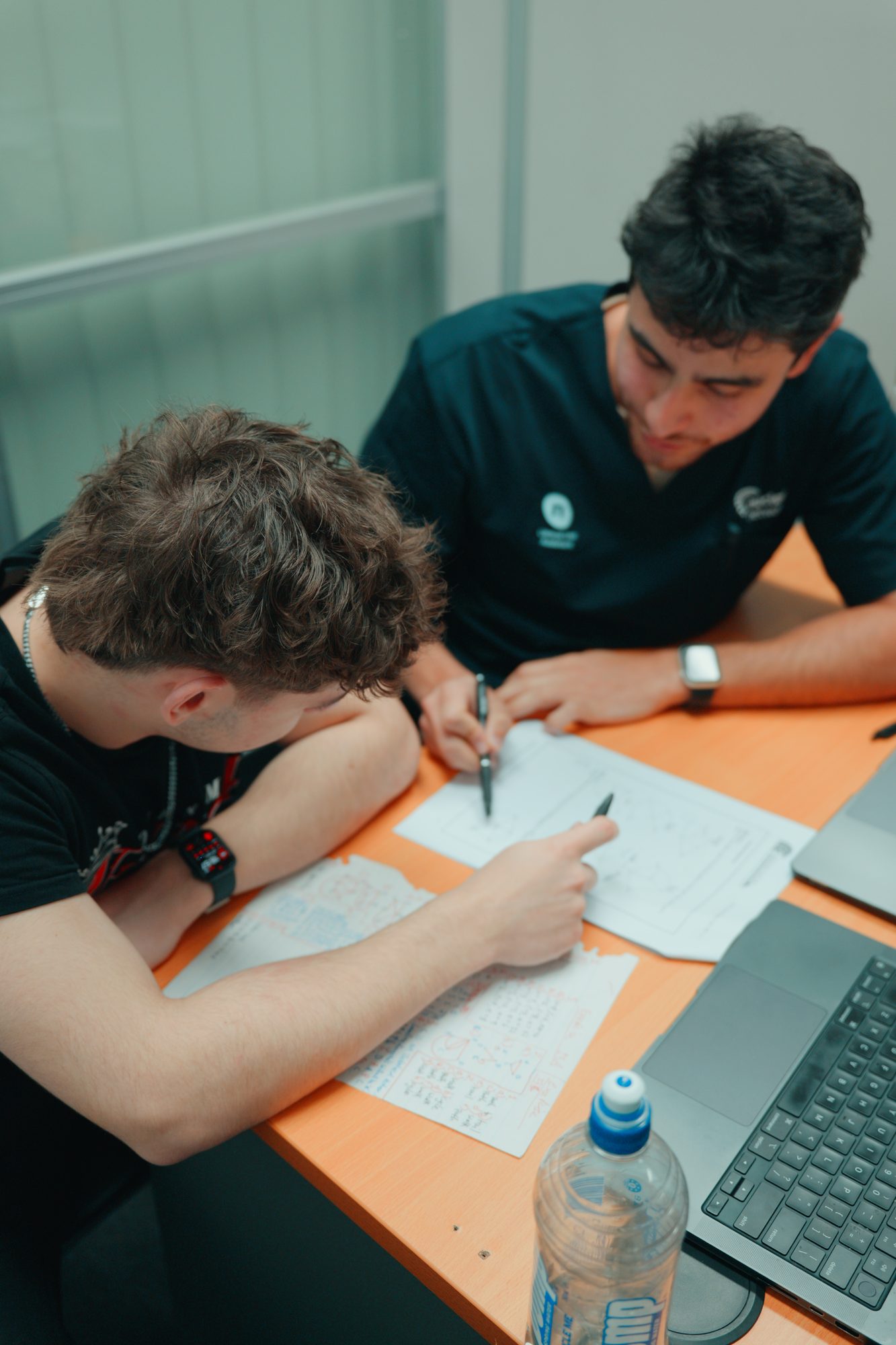 A Spartan Tuition tutor working one-on-one with a student